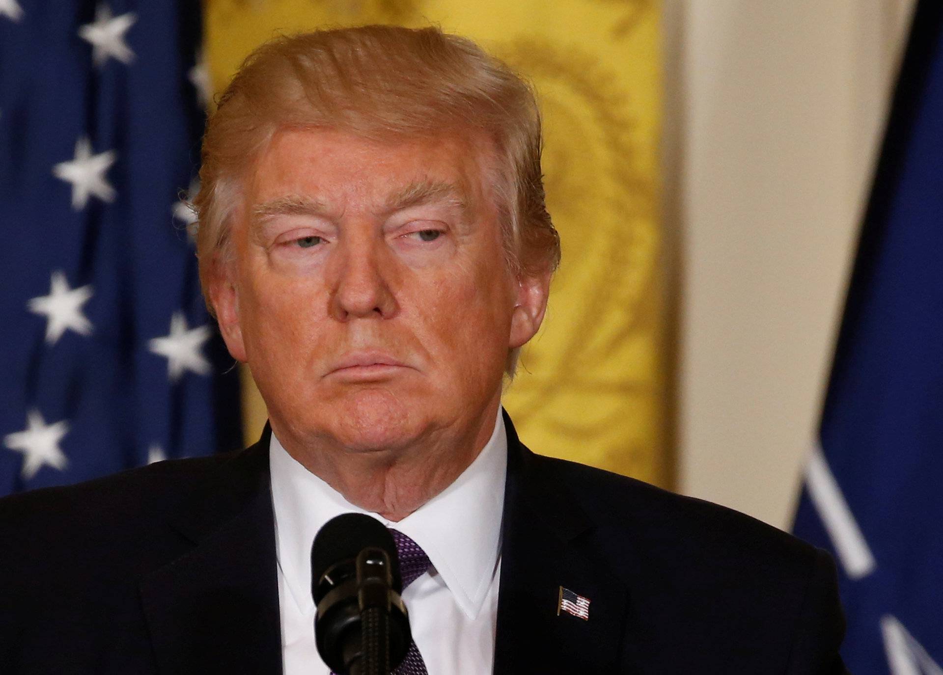 U.S.  President Trump listens during joint news conference with NATO Secretary General Stoltenberg at the White House in Washington