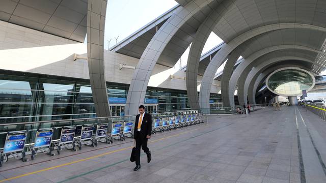 FILE PHOTO: A passenger is seen at the departure terminal three of Dubai Airports in Dubai