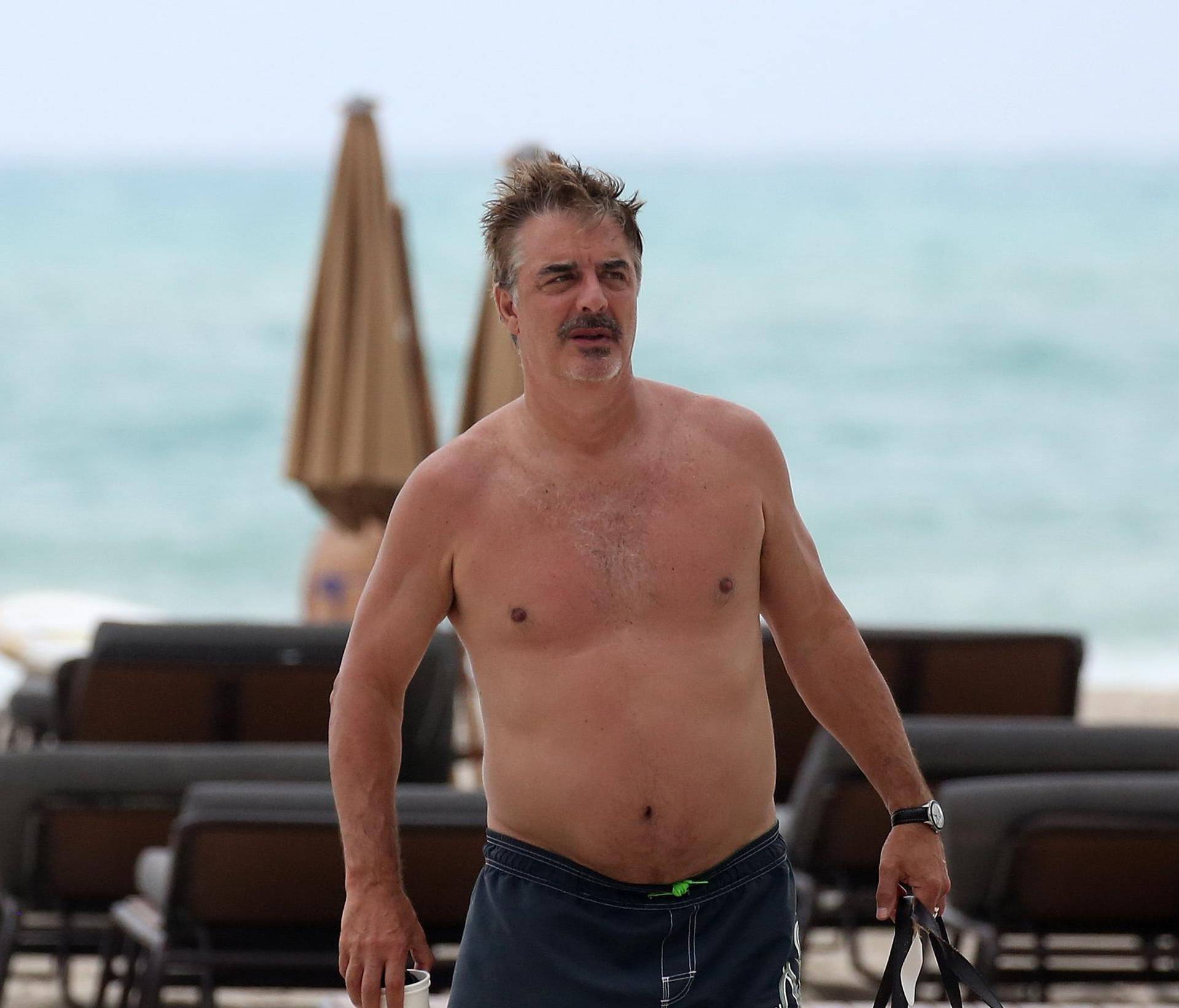Sex and the City actor Chris Noth  relaxes shirtless on the beach in Miami