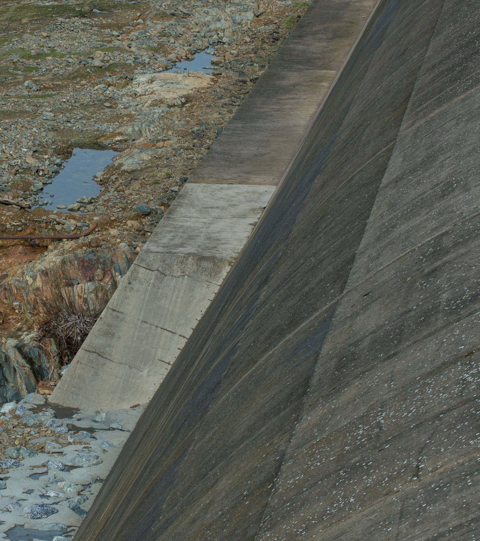 Handout photo of California Department of Water Resources crews inspect and evaluate the erosion just below the Lake Oroville Emergency Spillway site after lake levels receded, in Oroville