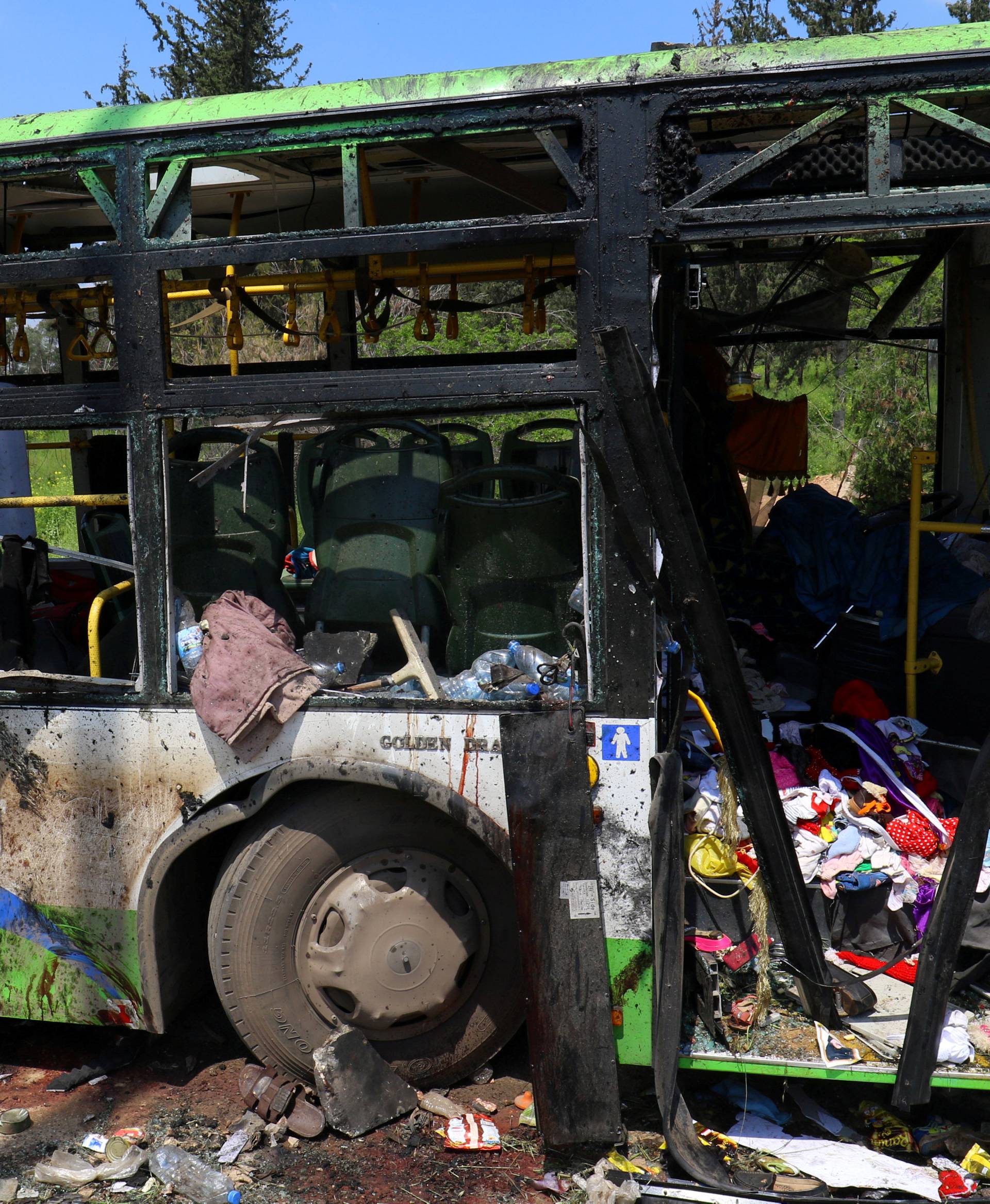 FILE PHOTO: A damaged bus is seen after an explosion at insurgent-held al-Rashideen