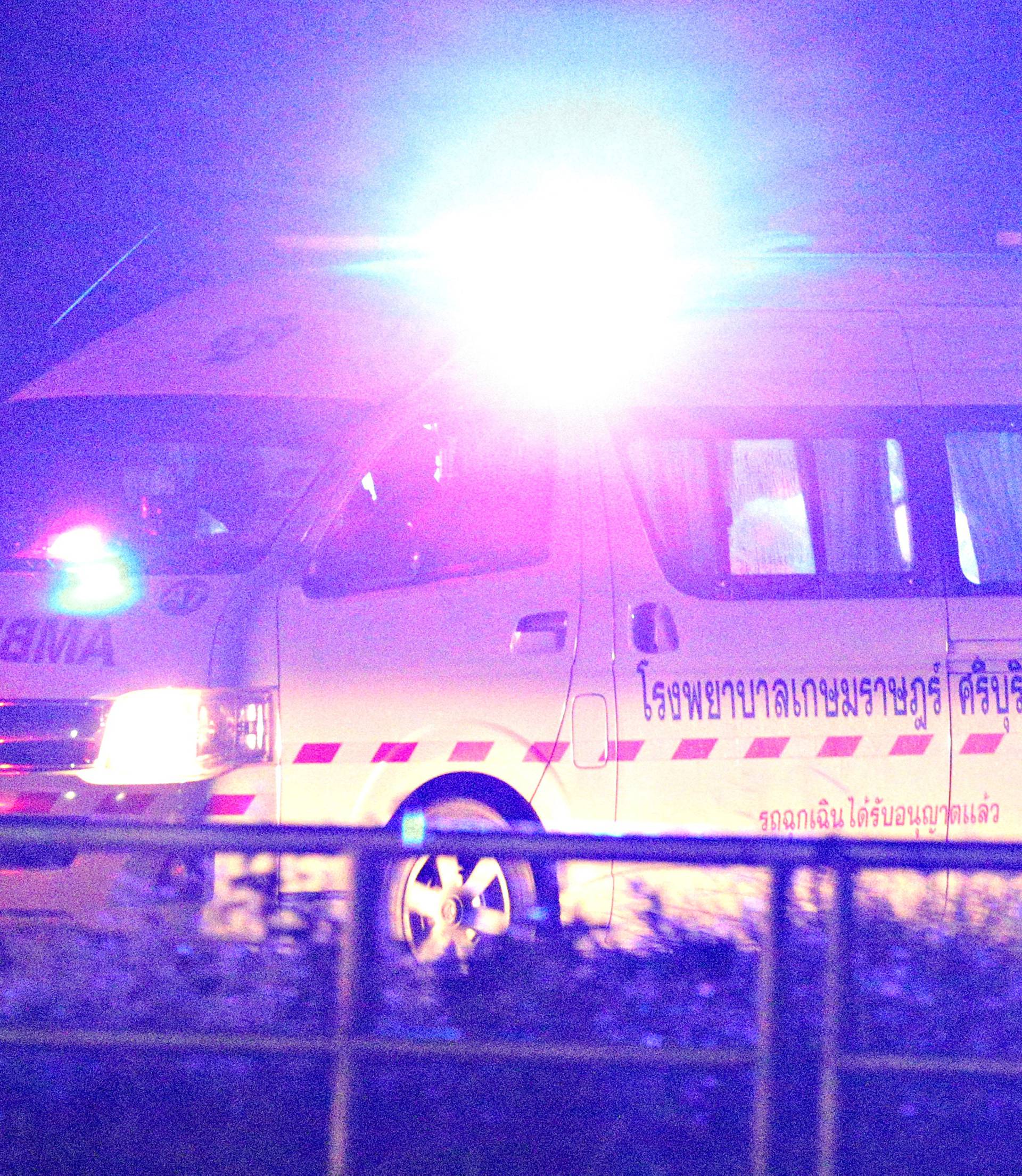 An ambulance carrying rescued schoolboys exits at a military airport in the northern province of Chiang Rai