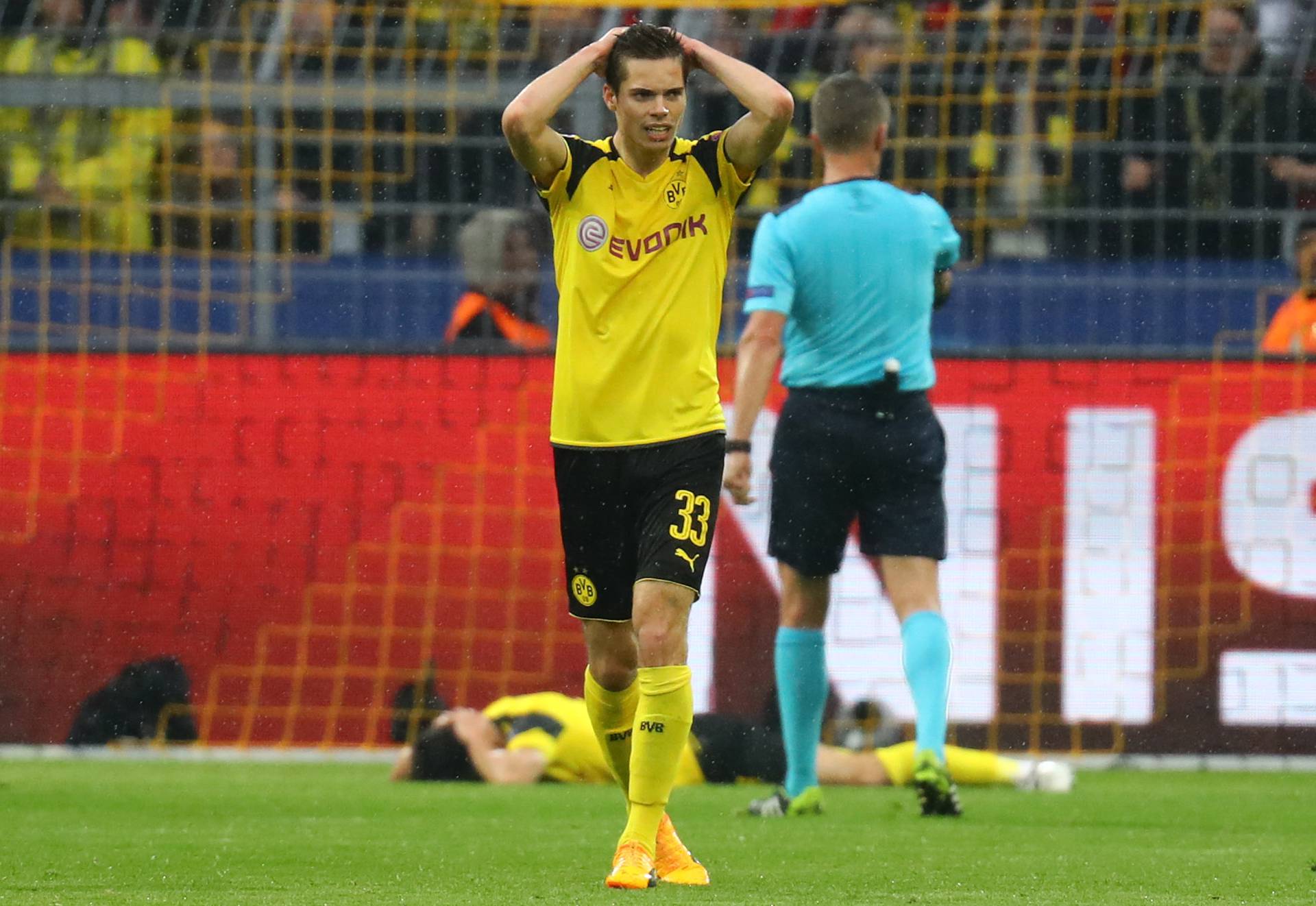 Borussia Dortmund's Julian Weigl looks dejected