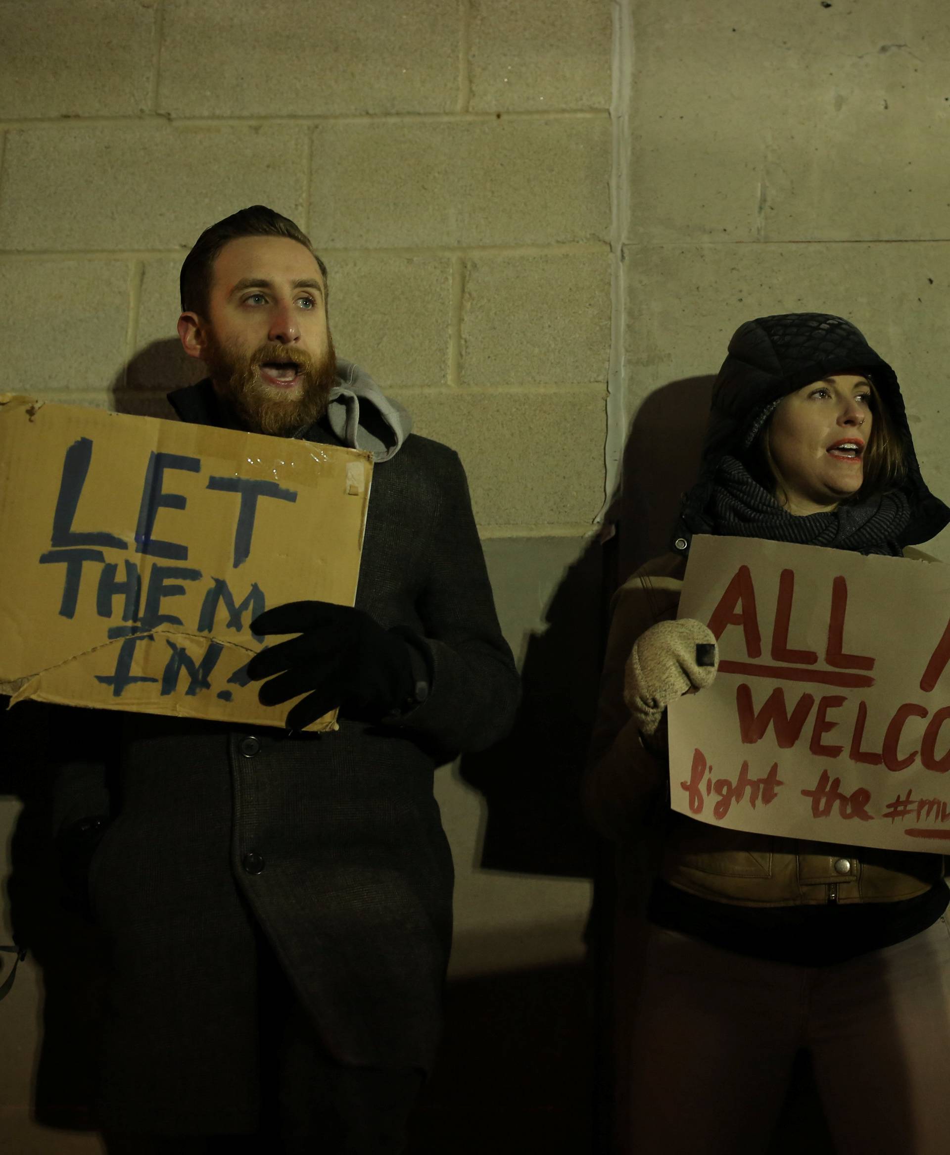 Protesters gather outside Terminal 4 at JFK airport in opposition to U.S. president Donald Trump's proposed ban on immigration in Queens, New York City, U.S.