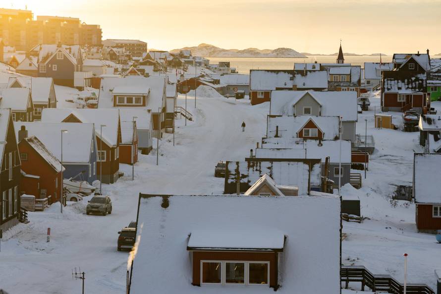 A person walks along a street on the day of the meeting between top U.S. officials and the foreign ministers of Denmark and Greenland, in Nuuk