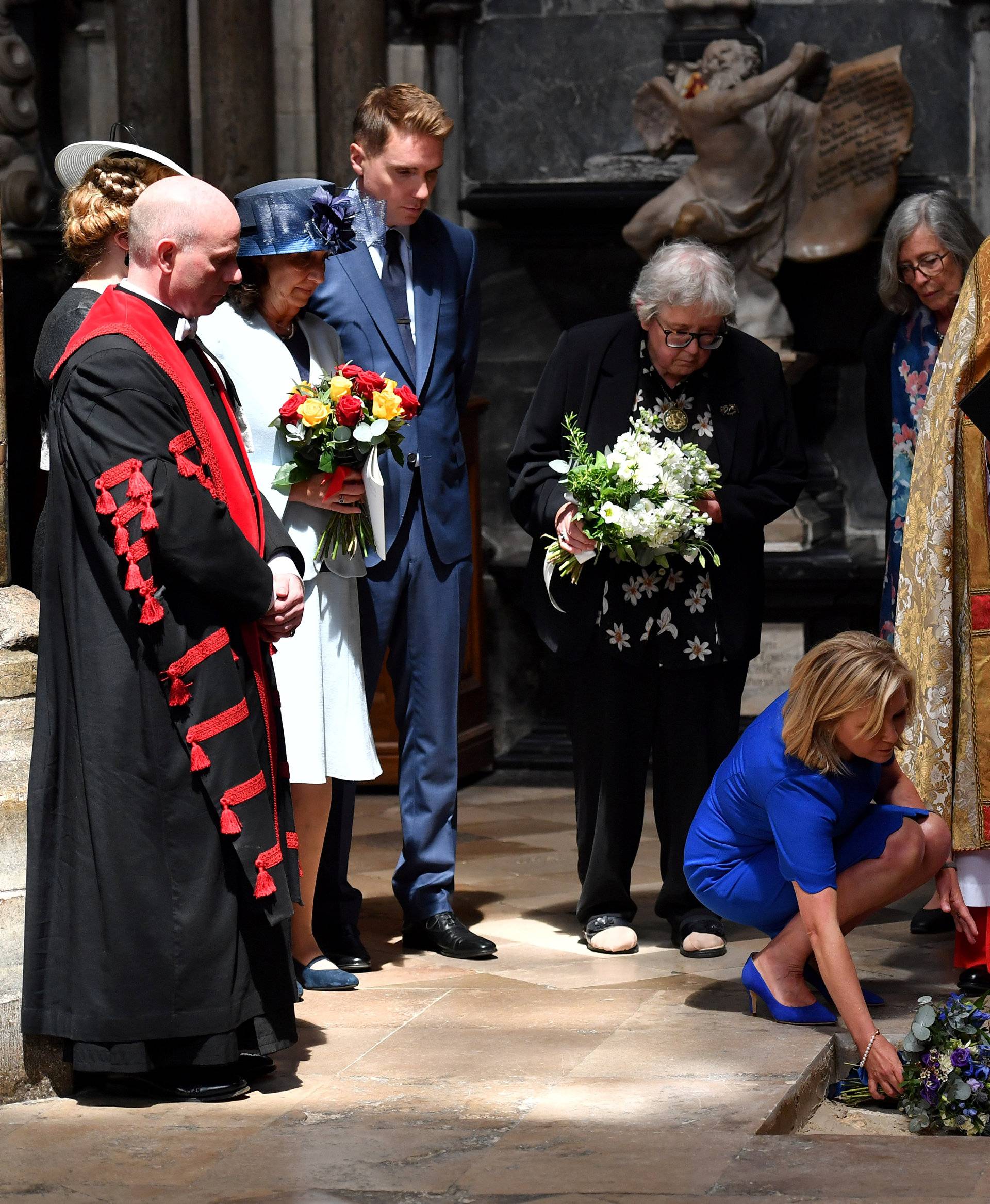 Dean of Westminster John Hall presides over the interment of the ashes of British scientist Stephen Hawking during a memorial service at Westminster Abbey in London