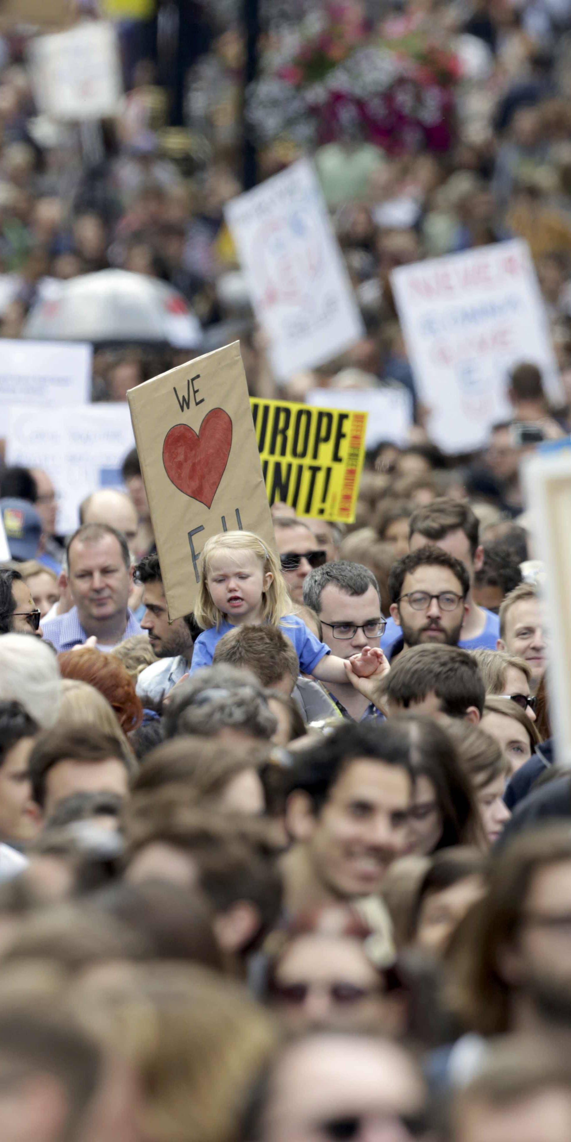 People hold banners during a demonstration against Britain's decision to leave the European Union, in central London