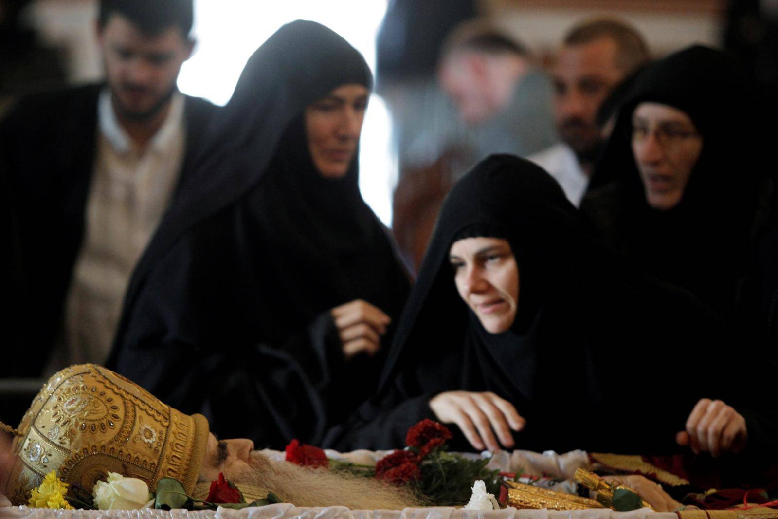 Nuns pay respect during funeral of Metropolitan Amfilohije Radovic in Podgorica