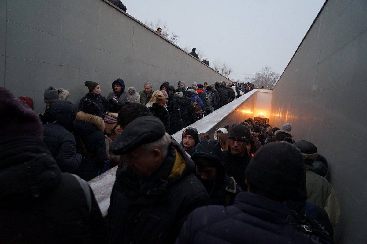 People are seen at the site of a crash involving a passenger bus in Moscow