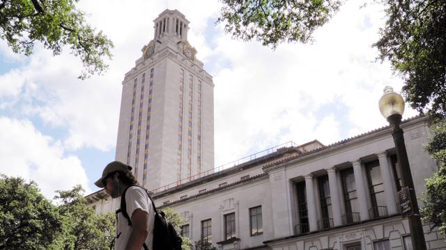 FILE PHOTO: A student walks at the University of Texas campus in Austin