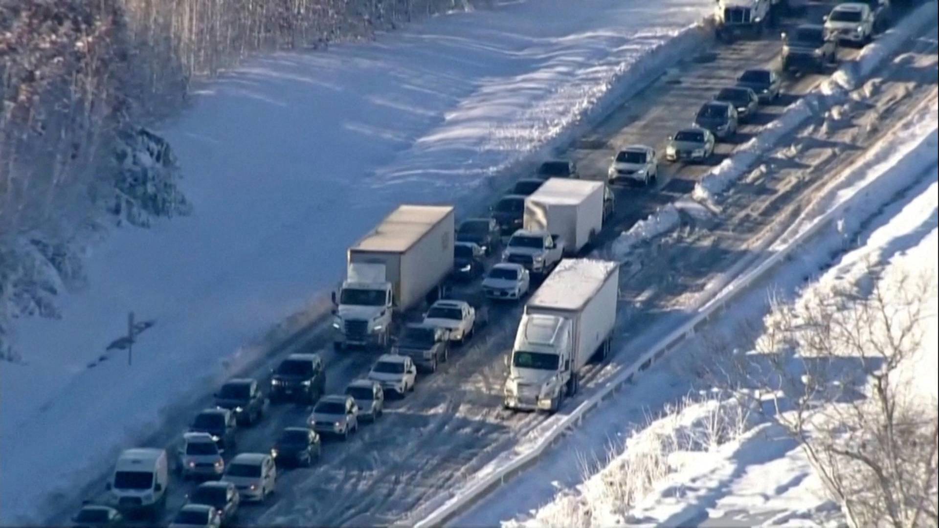 Vehicles are seen on an icy stretch of Interstate 95