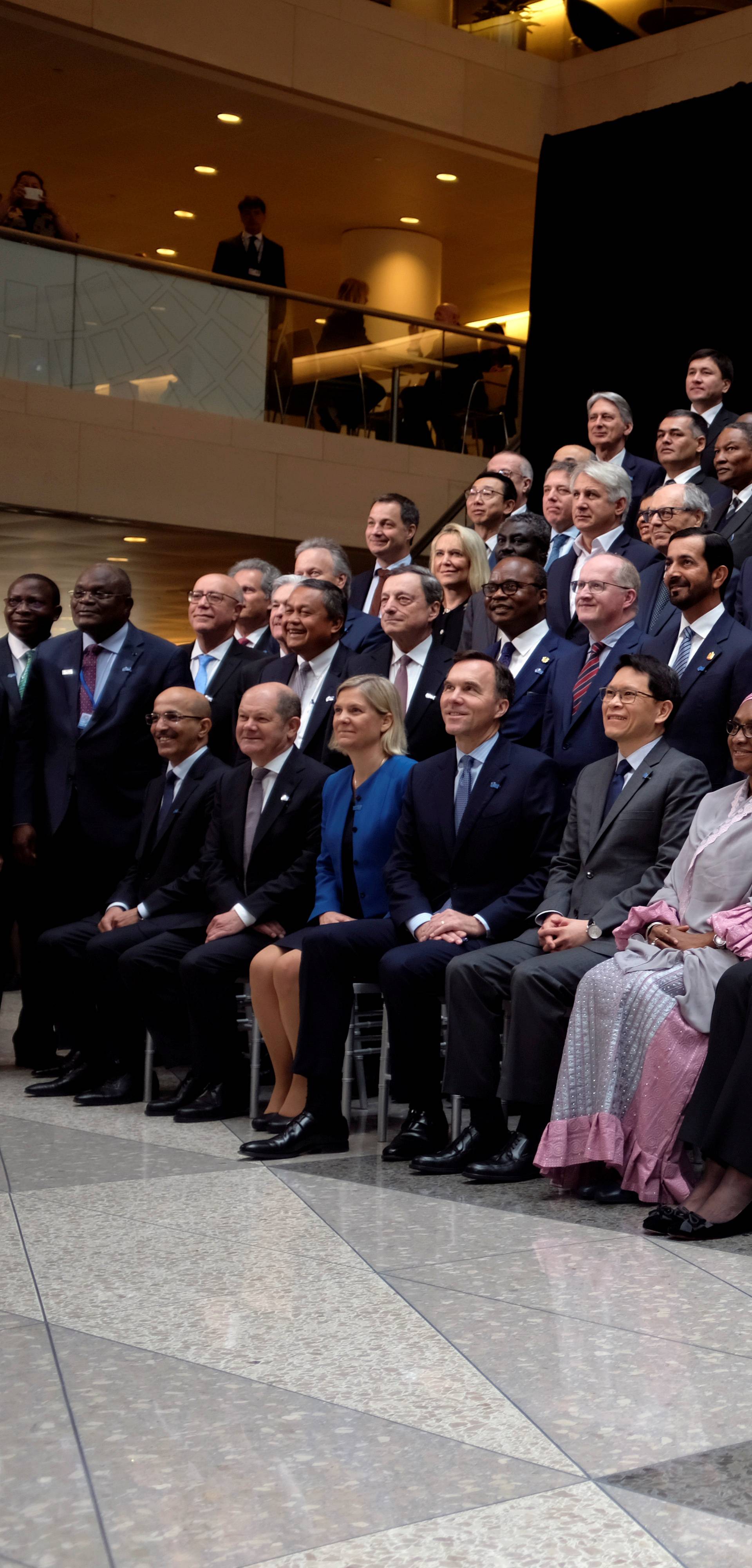 FILE PHOTO: Central bank governors and other global finance officials sit for a group photo at the IMF and World Bank's 2019 Annual Spring Meetings, in Washington