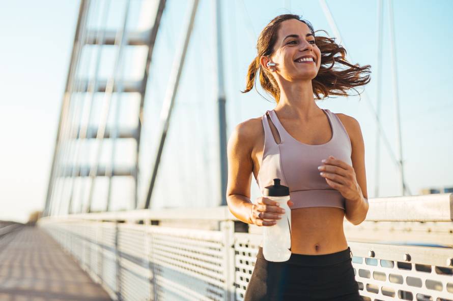 Energetic,Woman,Jogging,On,A,Bridge,,Embodying,Health,,Vitality,,And