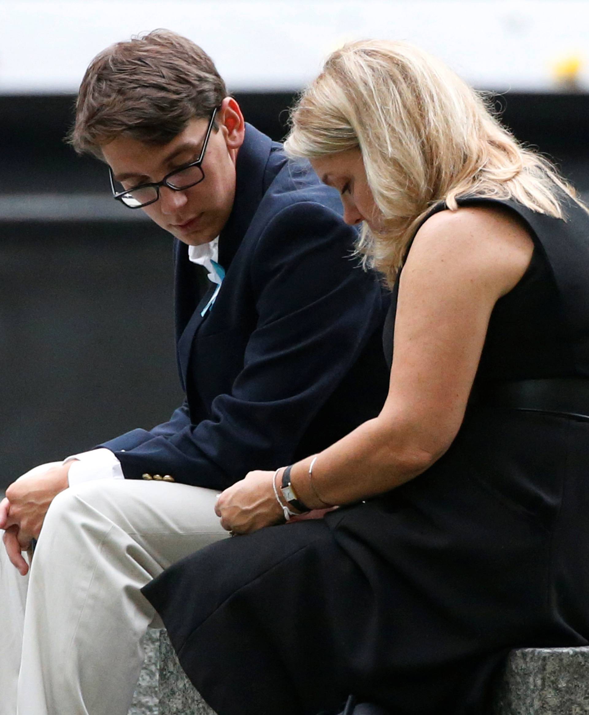 Guests sit near the memorial before the start of the ceremony marking the 15th anniversary of the attacks on the World Trade Center, at The National September 11 Memorial and Museum in New York