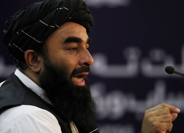 Taliban spokesman Zabihullah Mujahid speaks during a news conference in Kabul