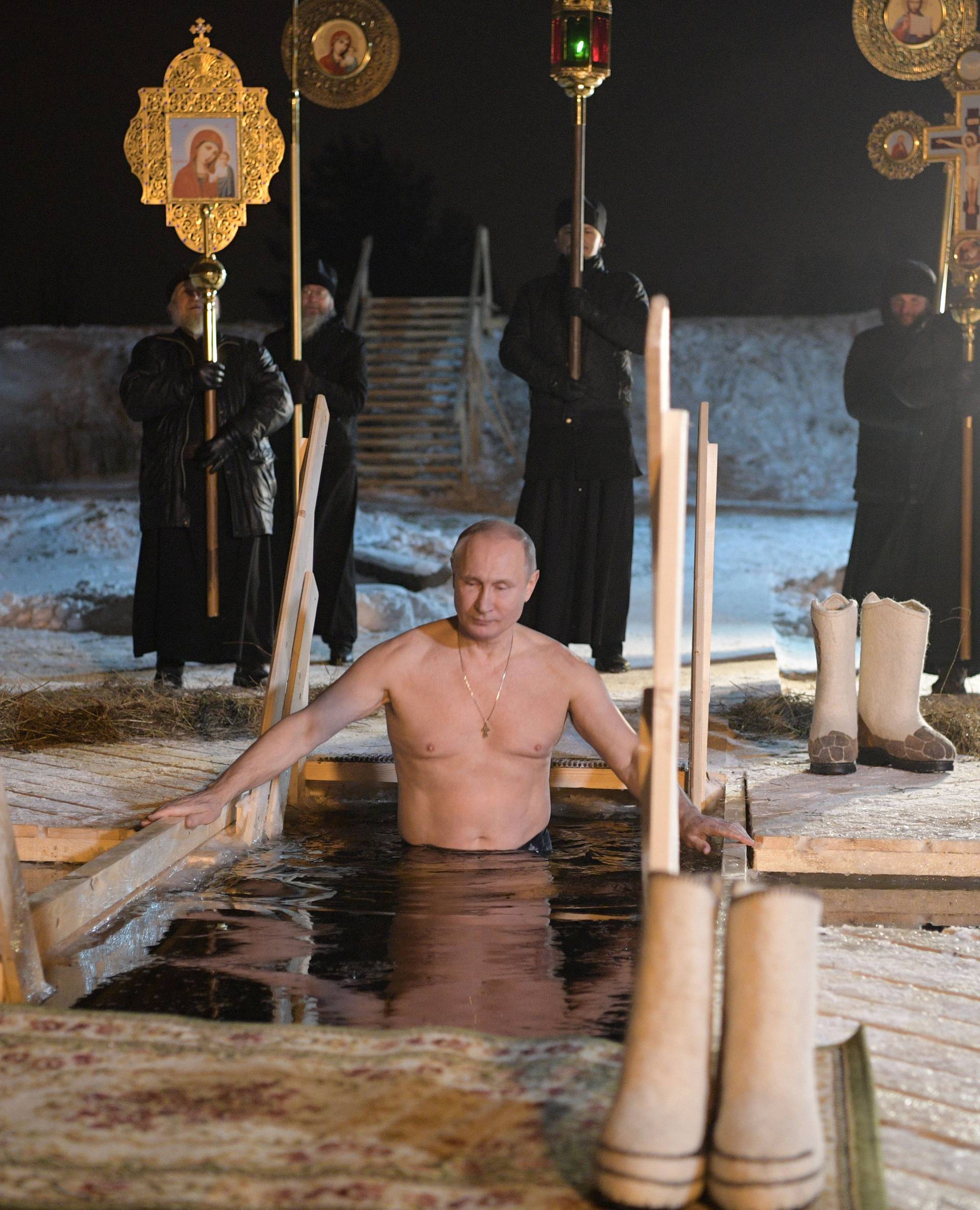 Russian President Vladimir Putin takes a dip in the water during Orthodox Epiphany celebrations at lake Seliger, Tver region