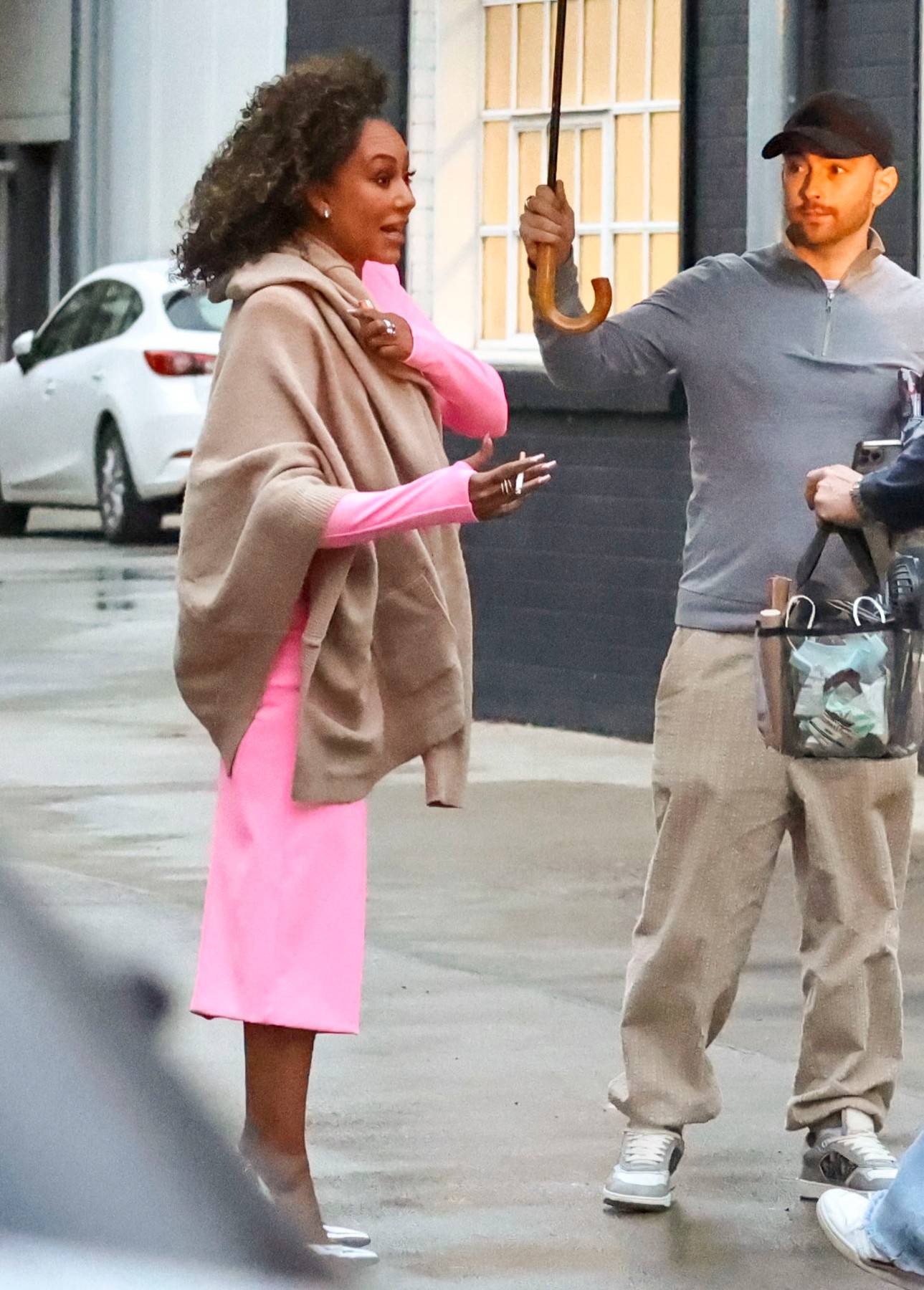 EXCLUSIVE: *NO DAILYMAIL ONLINE* Thighs The Limit! Mel B Shows Off Her Some Leg In A High Cut Hot Pink Dress, Stopping To "Get The Shot" In The Rain, While Leaving A Glamorous Photoshoot In Sydney