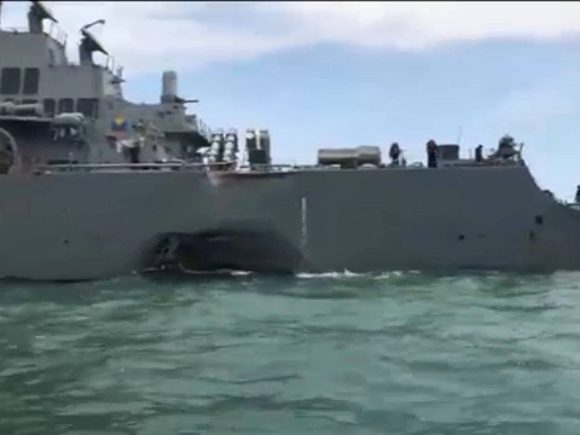 Damage is seen on the U.S. Navy guided-missile destroyer USS John S. McCain after a collision, in Singapore waters in this still frame taken from video