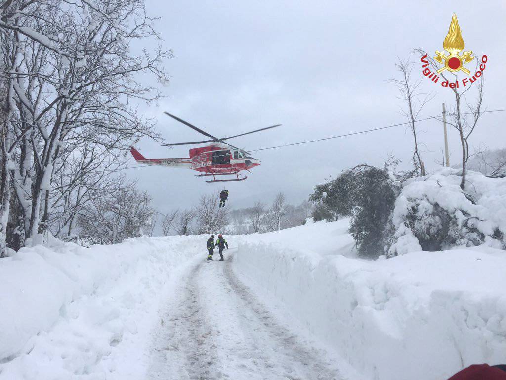 Firefighters arrive near Hotel Rigopiano, hit by an avalanche, in Farindola