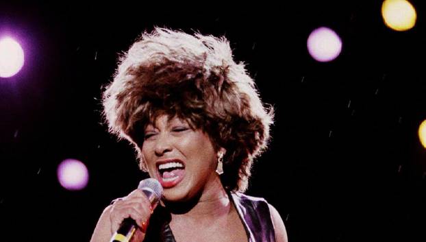 FILE PHOTO: Pop star Tina Turner performs during rainfall in the "Rock over danube" festival in Vienna