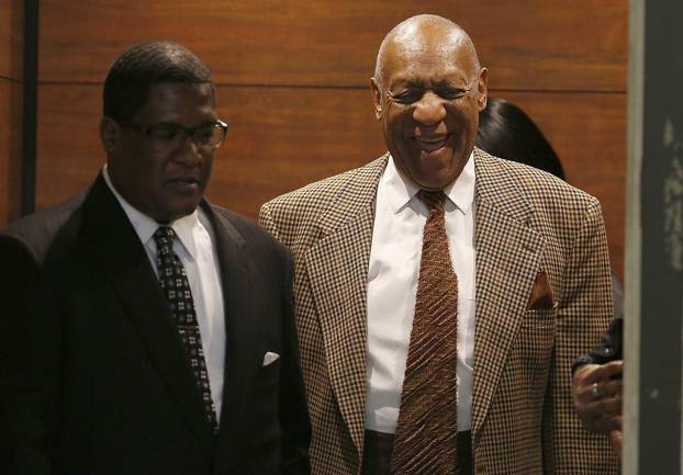 Cosby exits an elevator as he returns to court for a hearing in Norristown