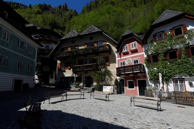 Empty benches are seen in the city of Hallstatt