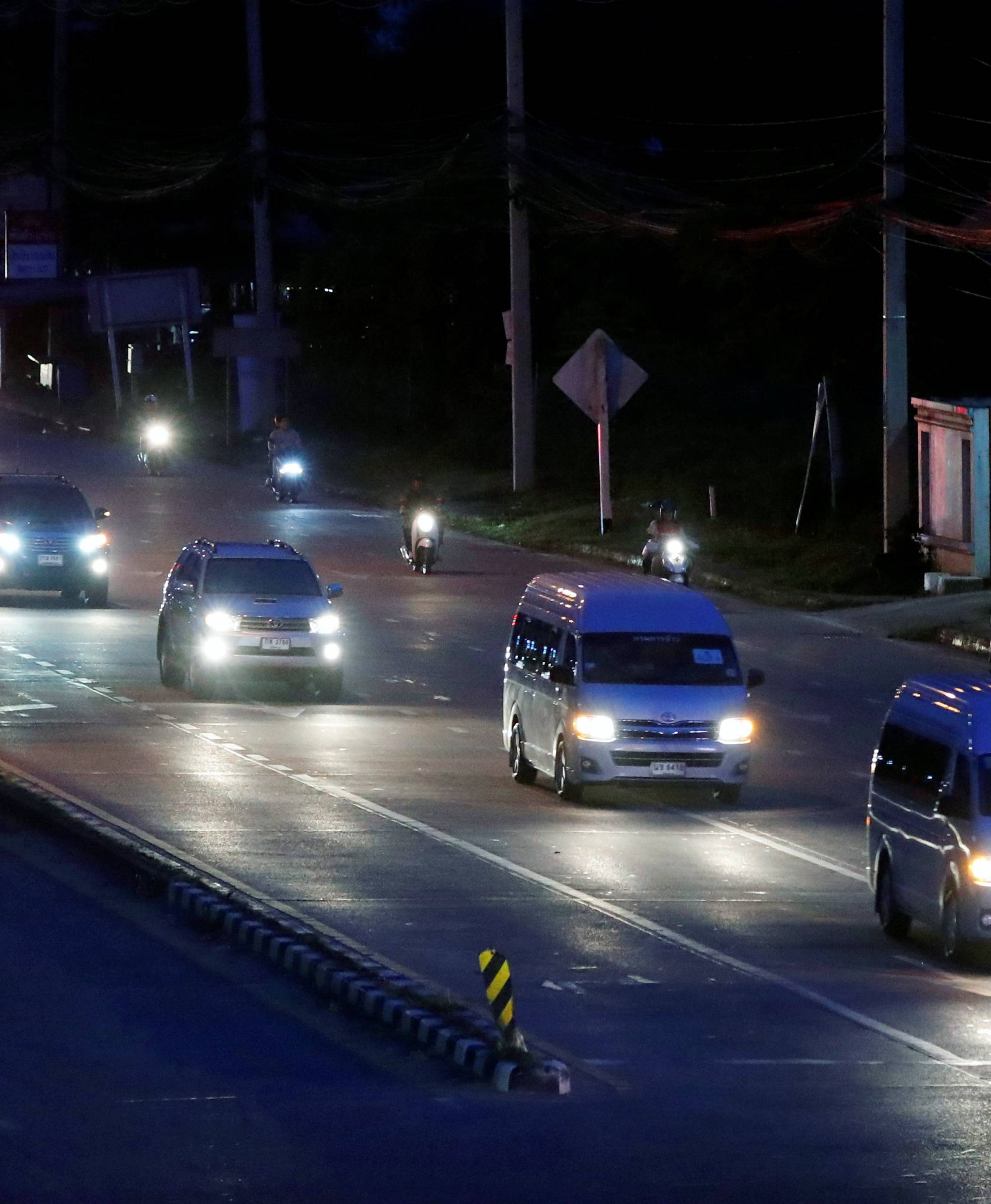 The motorcade of Thailand's Prime Minister Prayut Chan-o-cha travels towards Tham Luang cave complex in Chiang Rai