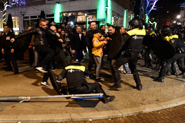 Riot police clash with demonstrators in the streets near the Turkish consulate in Rotterdam