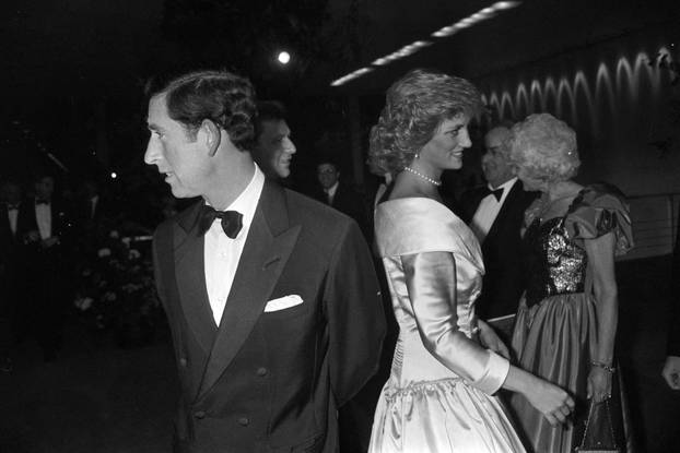 FILE PHOTO: Prince Charles turns around as his wife, Princess Diana talks to guests at a reception prior to West Berlin premiere of the Royal Ballet in the German Opera
