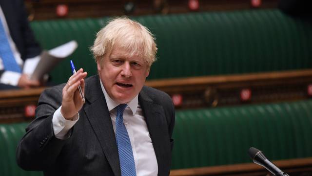 British Prime Minister Boris Johnson takes questions in Parliament, in London