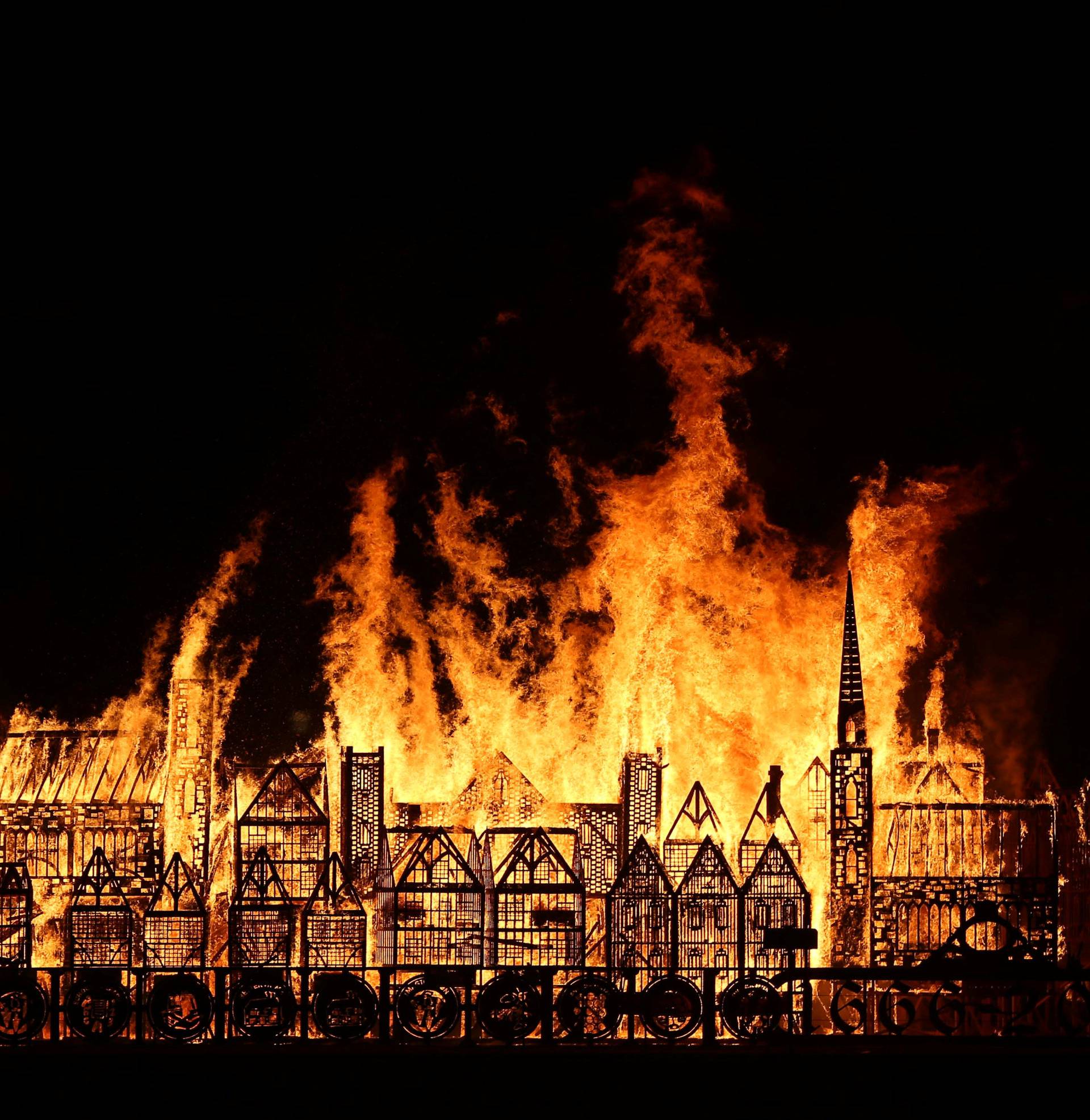 A 120-meter long model of the 17th century London skyline is set alight on the River Thames to commemorate the 1666 Great Fire of London in London