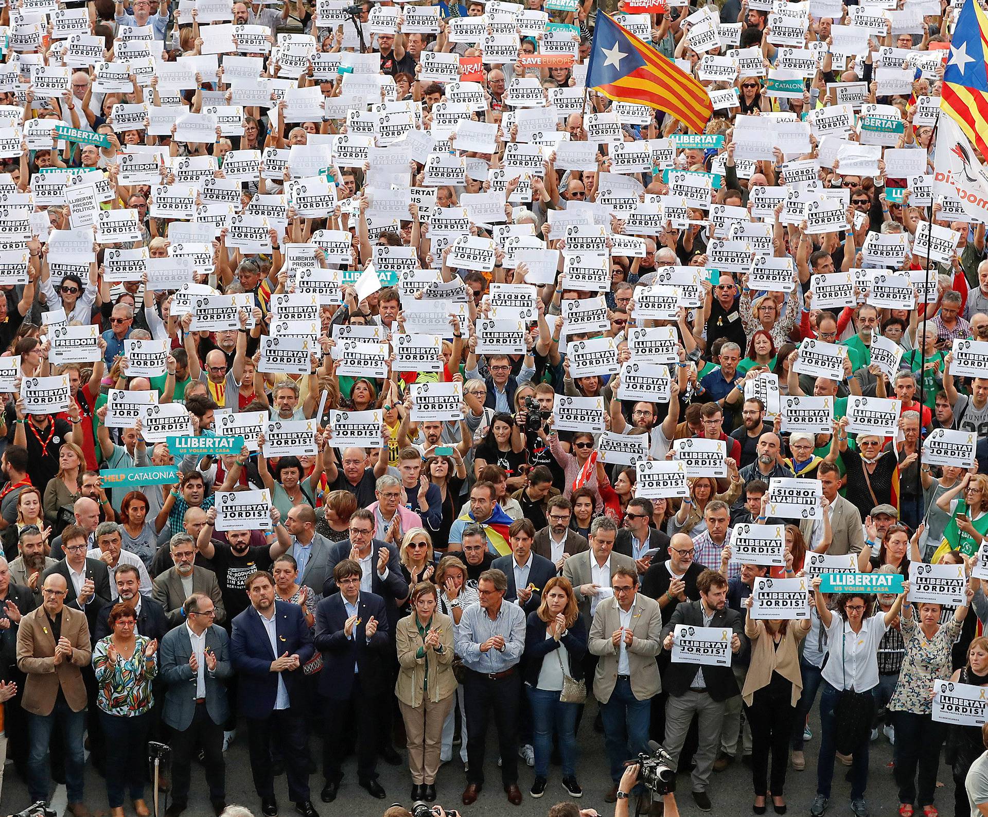 Catalan President Puigdemont and other government members attend a demonstration organised by Catalan pro-independence movements ANC (Catalan National Assembly) and Omnium Cutural, following the imprisonment of their two leaders in Barcelona