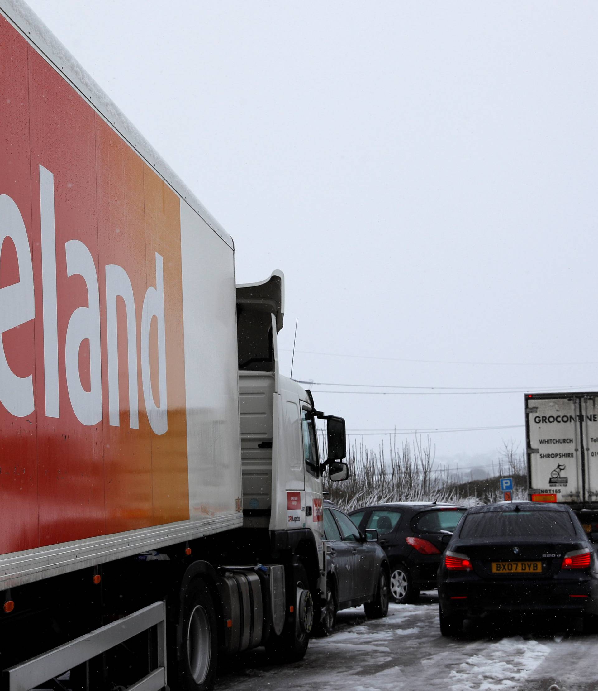 Vehicles backed up on the A50 are seen after a lorry crashed in the snow near Uttoxeter