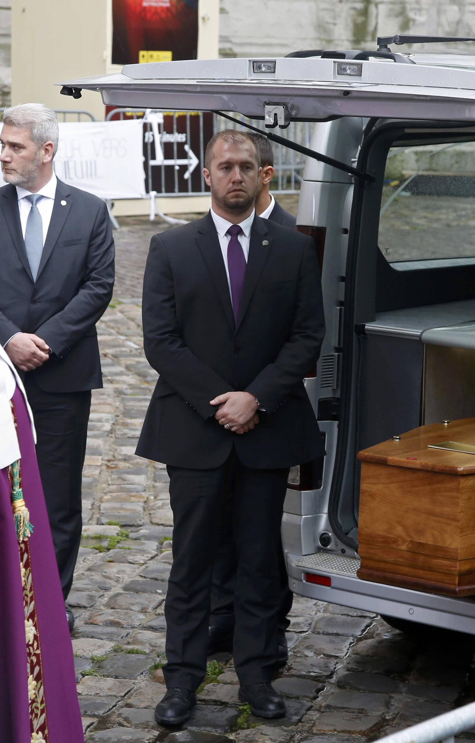 Archbishop of Rouen and Primate of Normandy Mgr Dominique Lebrun stands near the hearse carrying the coffin of slain French parish priest Father Jacques Hamel after a funeral ceremony at the Cathedral in Rouen
