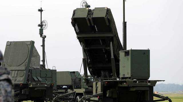 FILE PHOTO: JSDF soldier takes part in a drill to mobilise their PAC-3 missile unit in response to recent missile launch by North Korea, at U.S. Air Force Yokota Air Base in Fussa