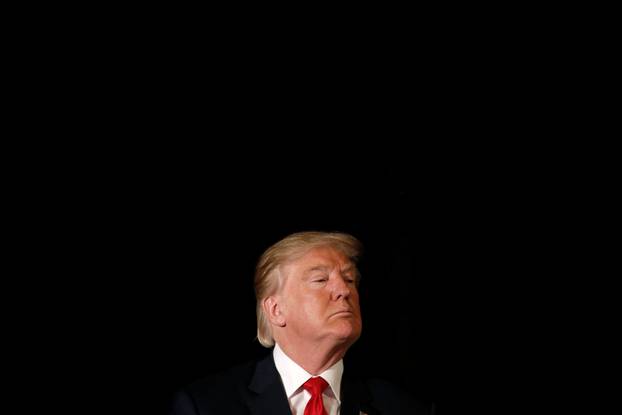 Republican presidential nominee Donald Trump listens to a question as he appears at the "Retired American Warriors" conference during a campaign stop in Herndon