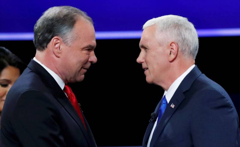 Democratic U.S. vice presidential nominee Senator Tim Kaine and Republican U.S. vice presidential nominee Governor Mike Pence shake hands as they arrive for their vice presidential debate at Longwood University in Farmville