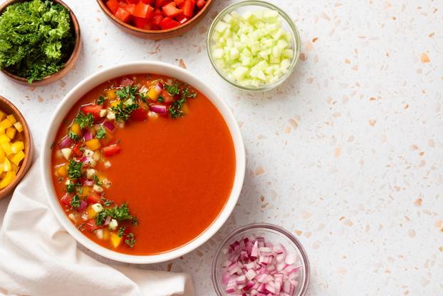 Spanish tomato gazpacho cold soup styled and decorated in white plate