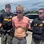 FILE PHOTO: Suspected Trump golf course gunman Ryan W. Routh stands handcuffed after his arrest during a traffic stop near Palm City