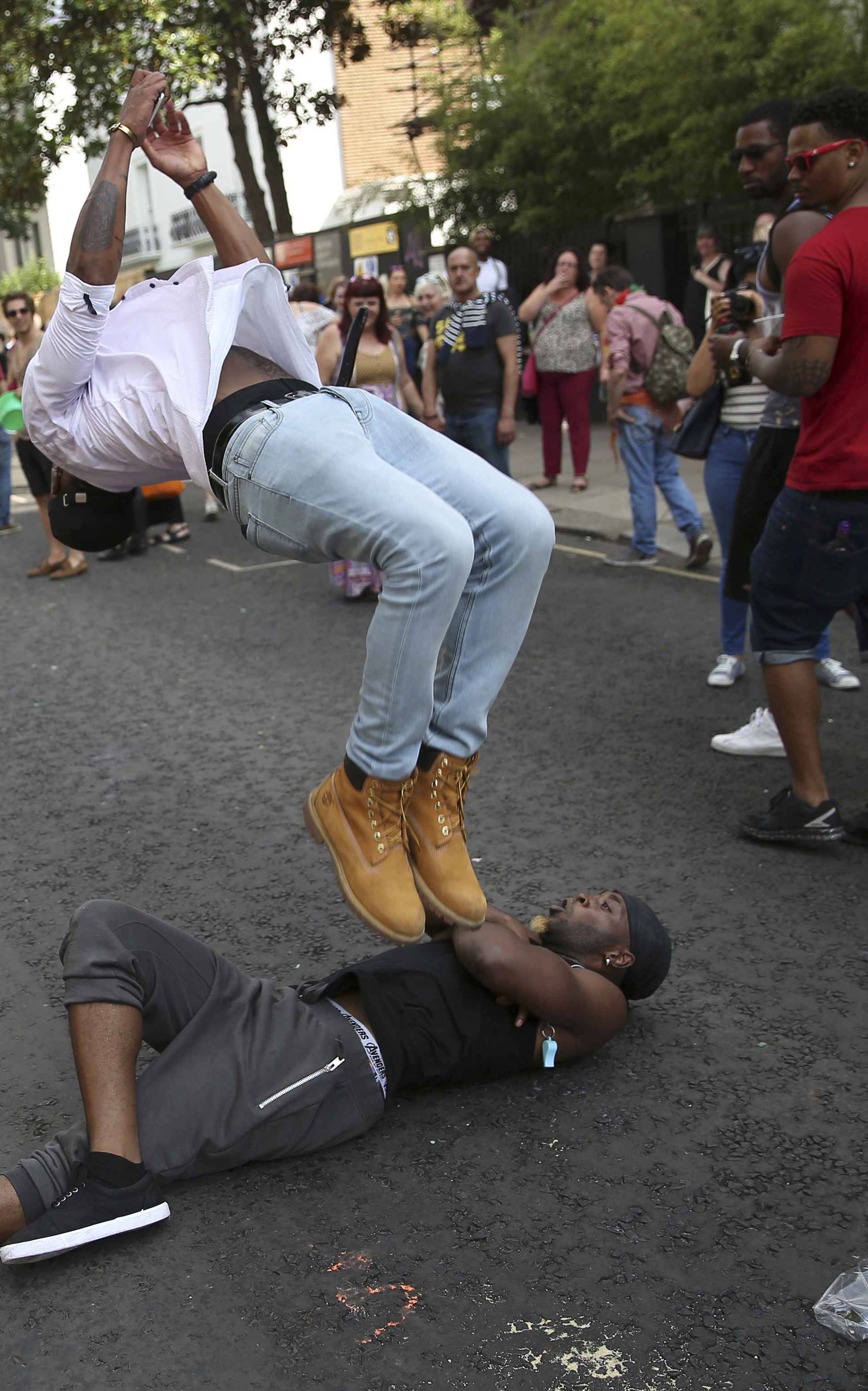 People dance during the Notting Hill Carnival in London