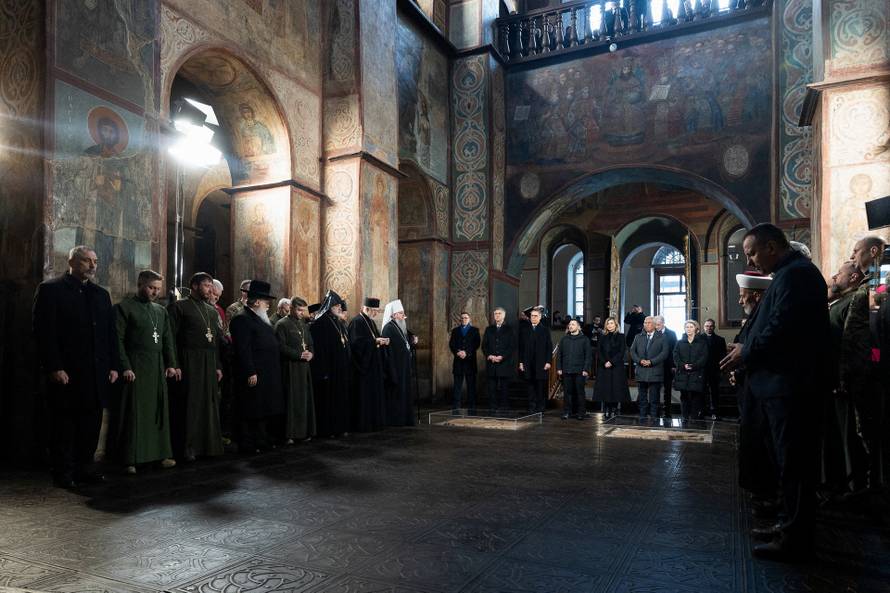 Prayer for peace inside the St. Sophia's Cathedral on the fourth anniversary of Russia's full-scale invasion, in Kyiv
