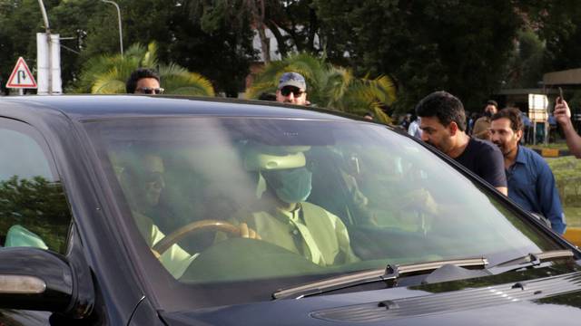 A vehicle carrying Pakistan's former Prime Minister Imran Khan arrives to the Supreme Court in Islamabad