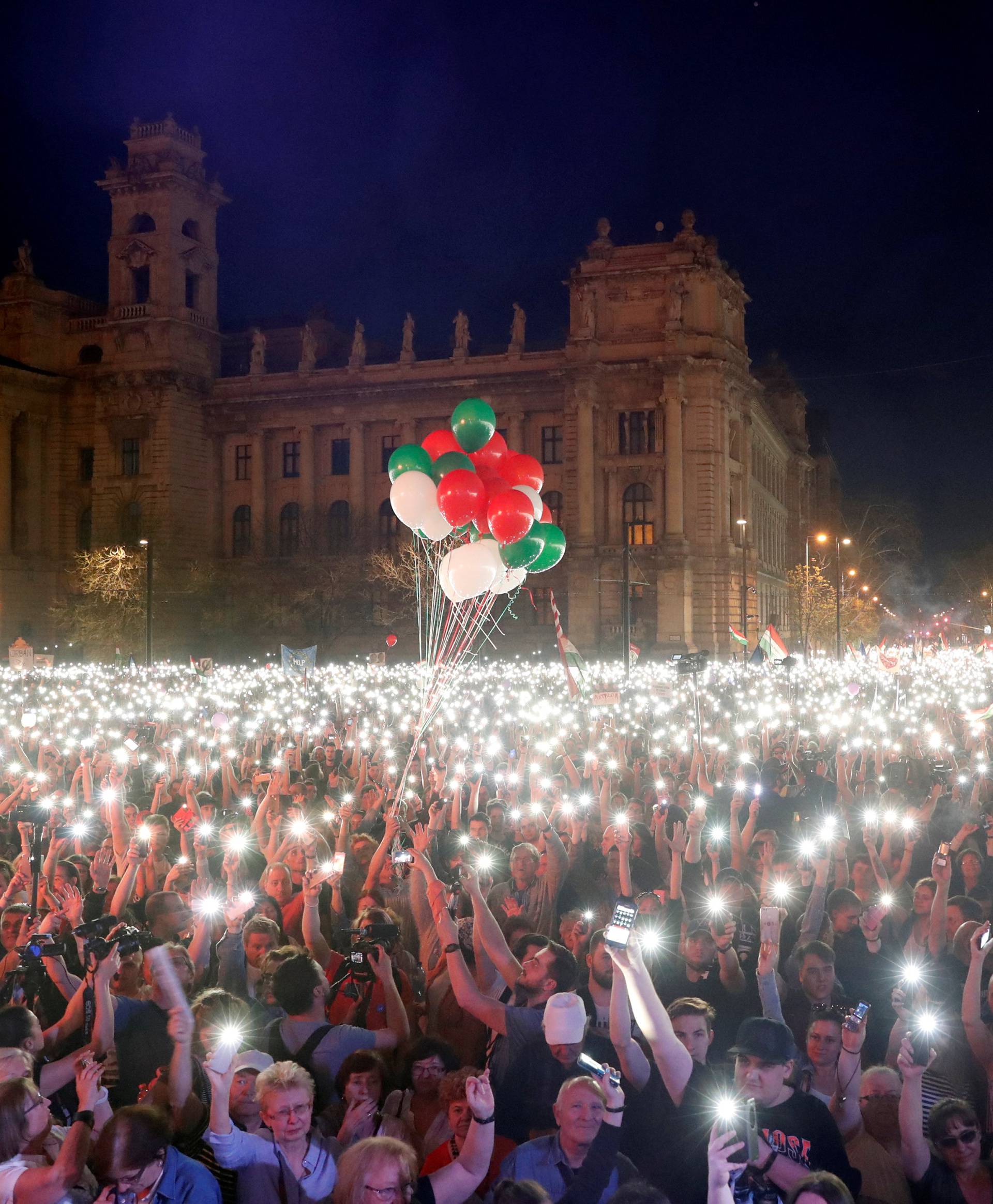 People attend a protest against the government of Prime Minister Viktor Orban in Budapest