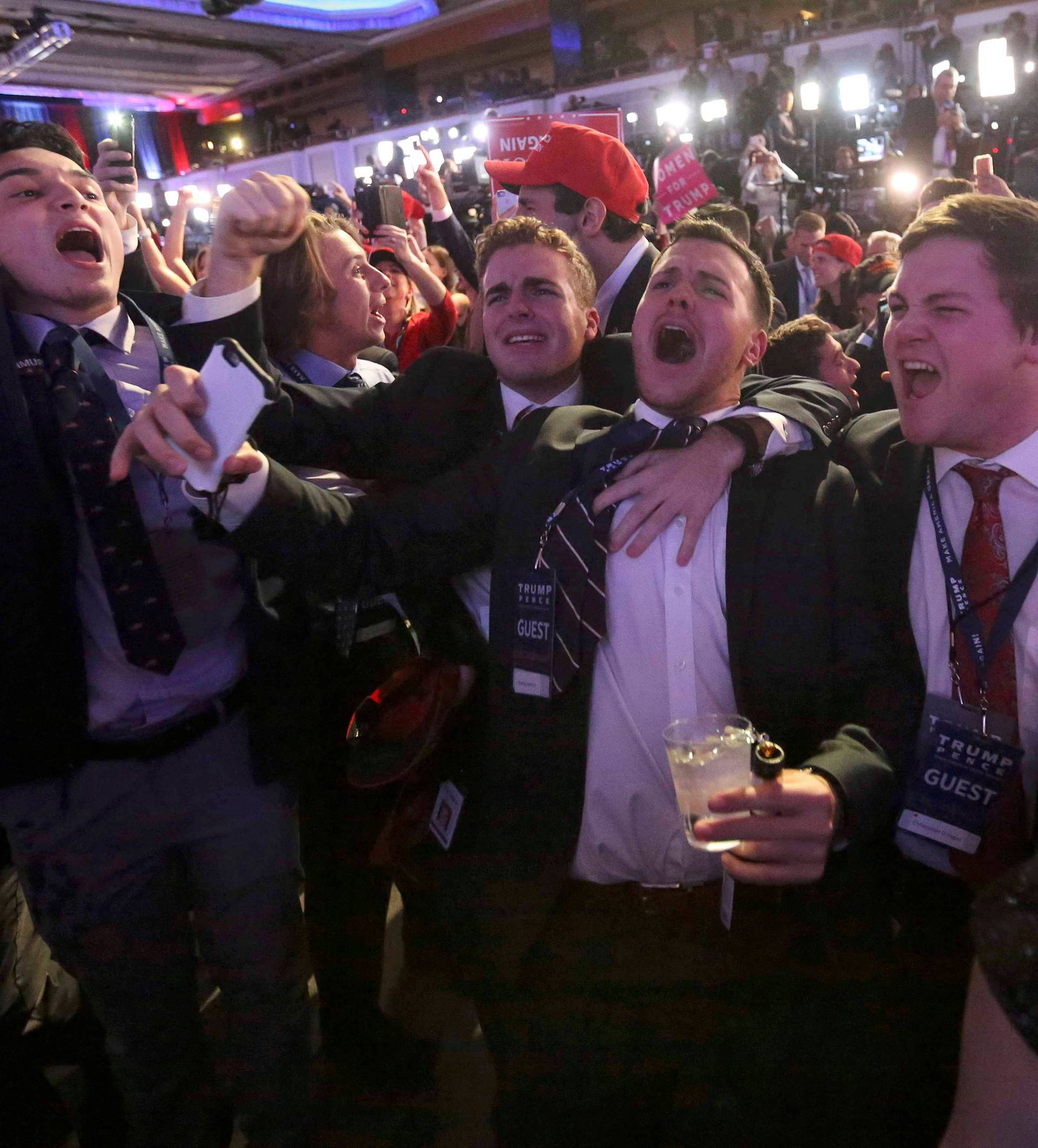 Supporters of U.S. Republican presidential nominee Donald Trump react at his election night rally in Manhattan