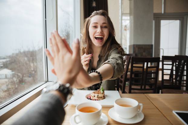 Happy woman giving five gesture
