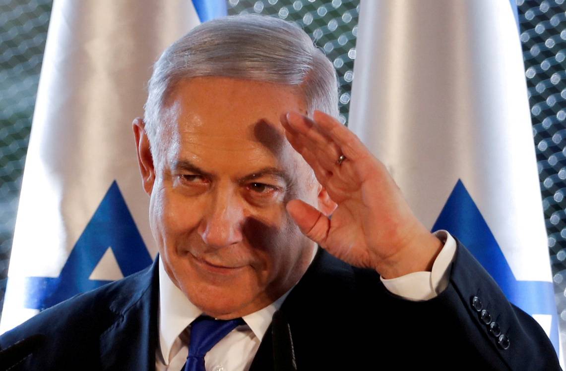FILE PHOTO: Israeli Prime Minister Benjamin Netanyahu gestures as he speaks during a state memorial ceremony at the Tomb of the Patriarchs, a shrine holy to Jews and Muslims, in Hebron