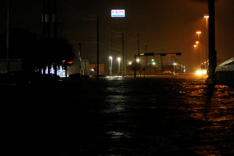 Lights stay on at a gas station despite rising floodwater after Hurricane Harvey inundated the Texas Gulf coast with rain causing widespread flooding, in Houston