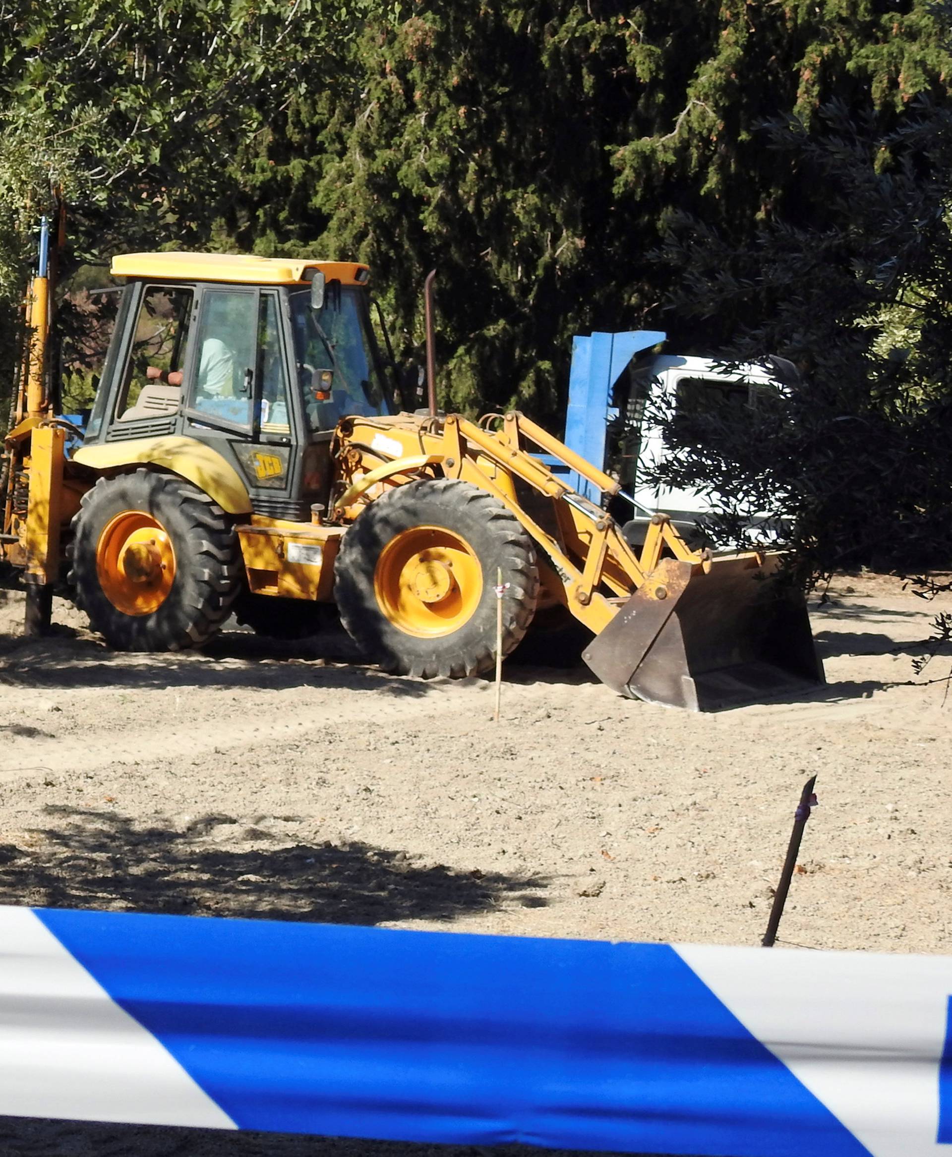 A bulldozer excavates a site during an investigation for Ben Needham on the island of Kos