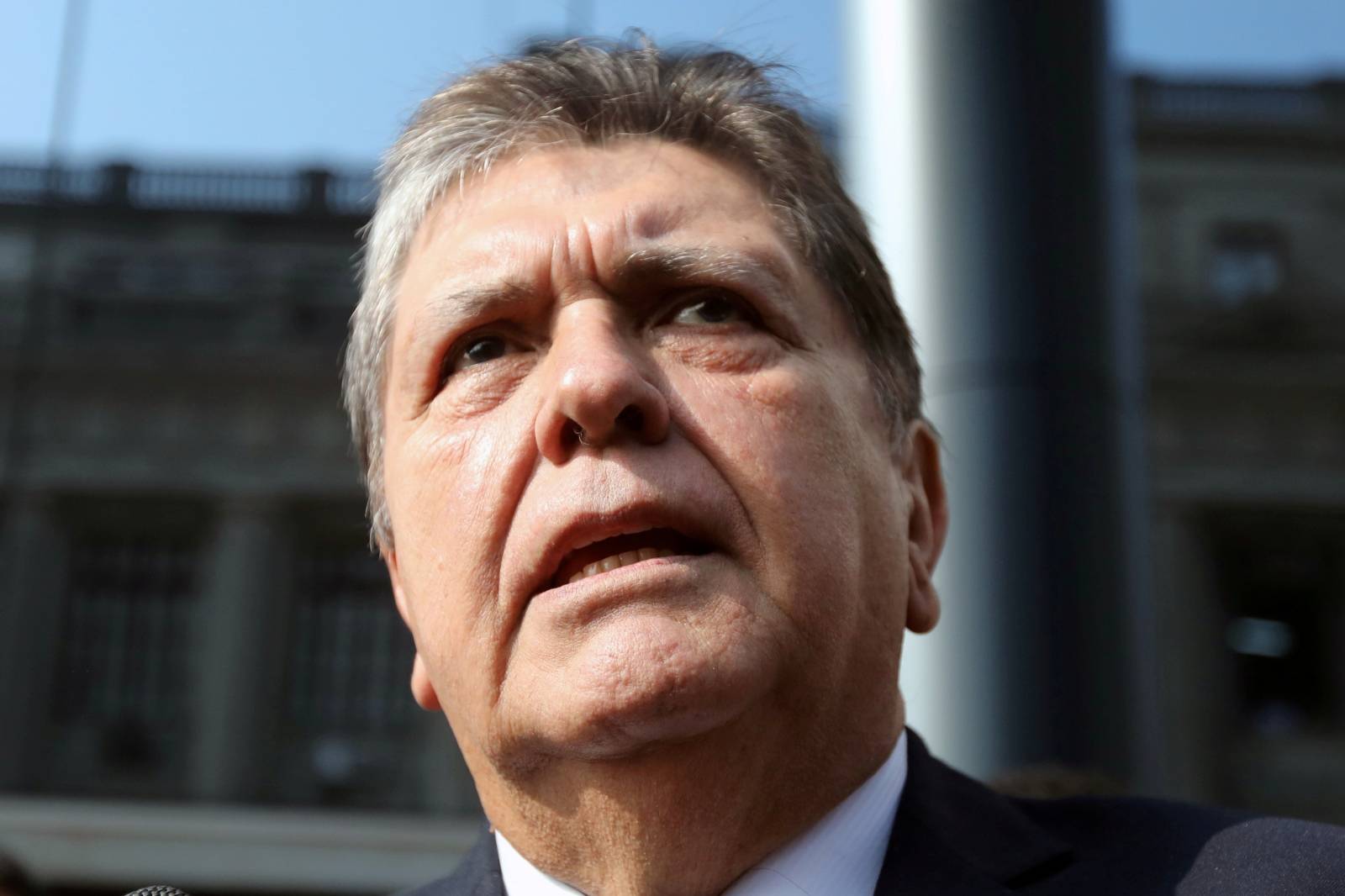 FILE PHOTO: Former Peruvian president Alan Garcia talks to the media as he arrives at the National Prosecution office in Lima