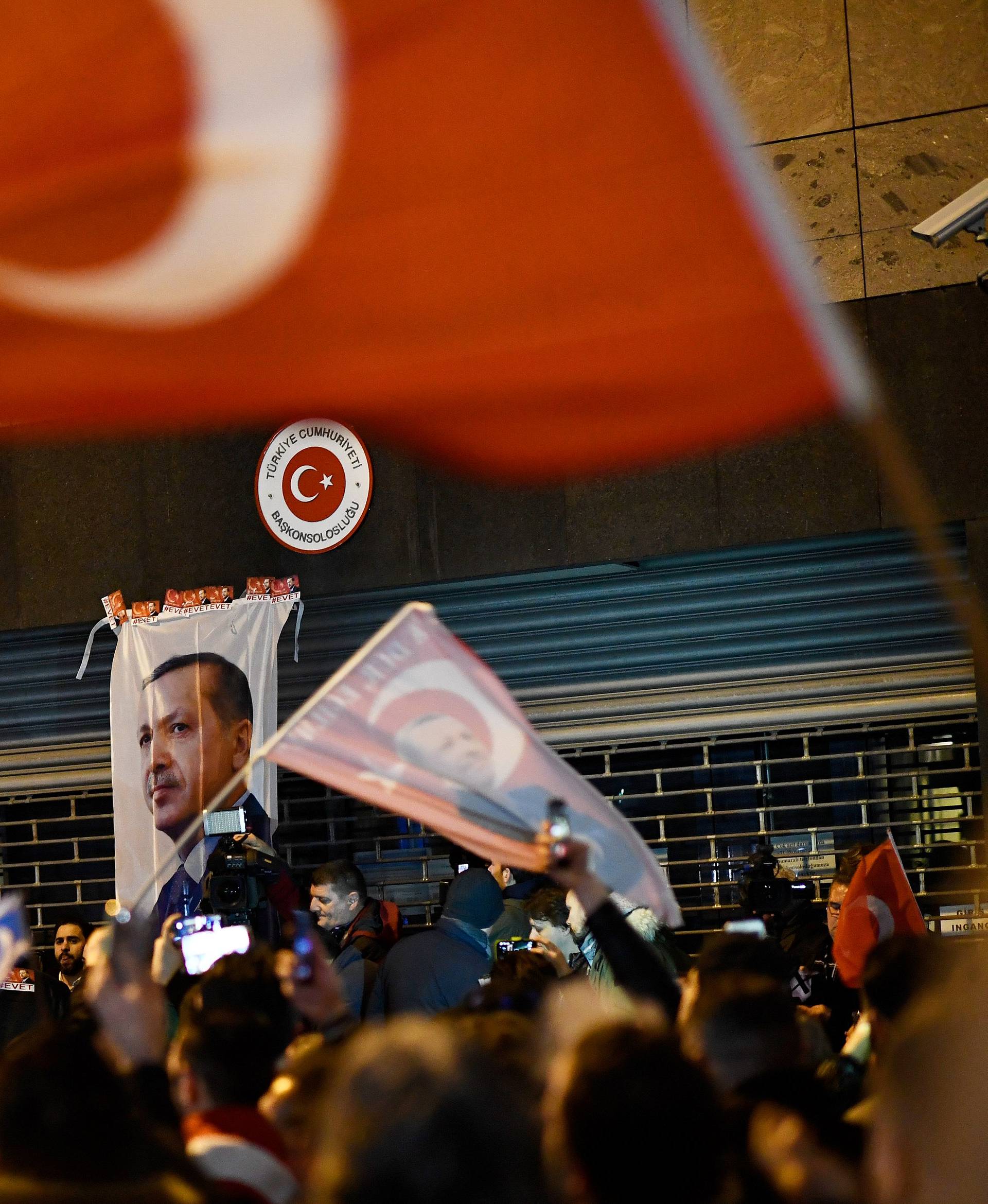 Demonstrators gather ahead of clashes with riot police outside the Turkish consulate in Rotterdam